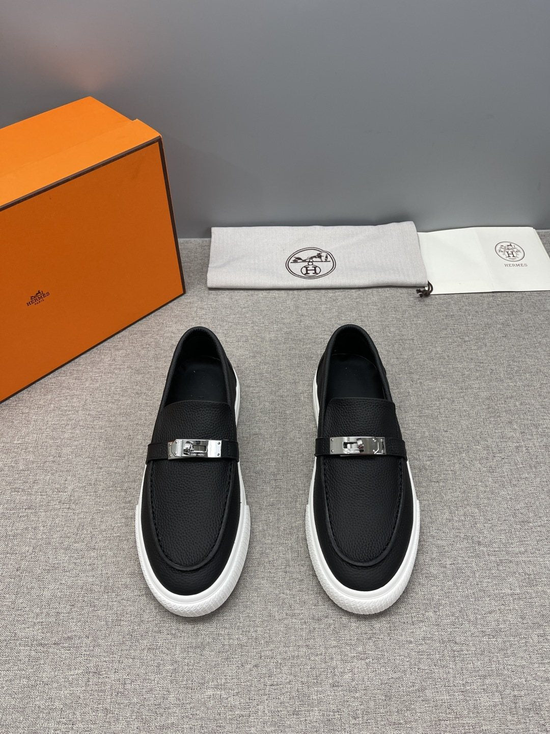 Hermès Textured Bar Loafers — front