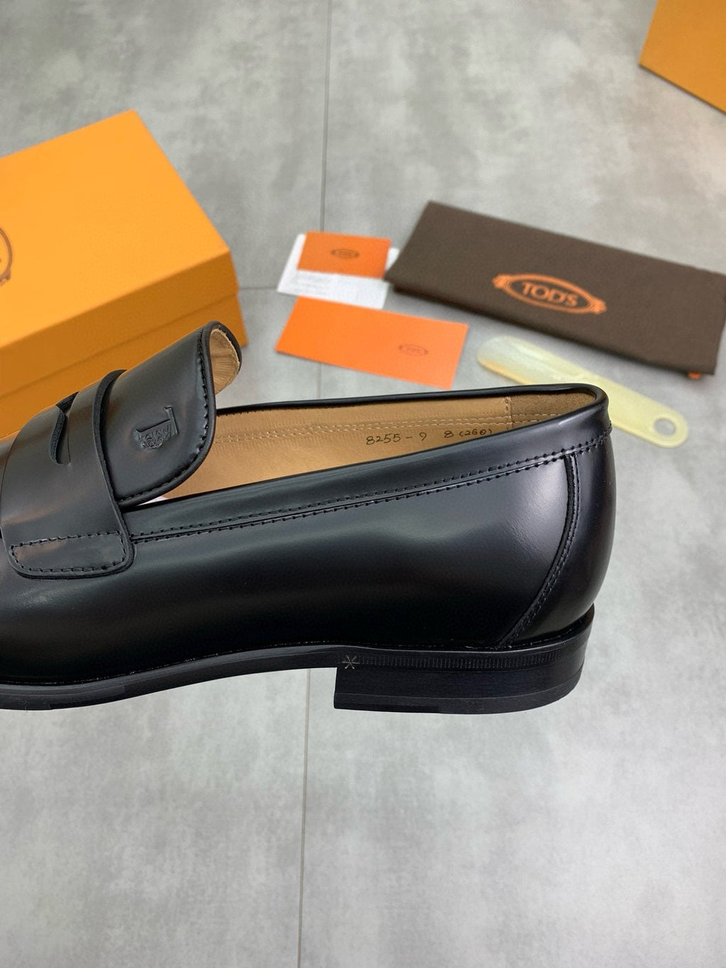 Tod's Black Penny Loafers — side