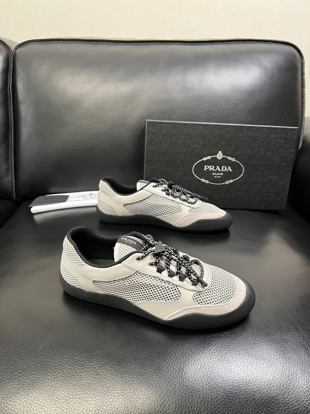 Prada White, Gray & Black Low-Top Sneakers — front